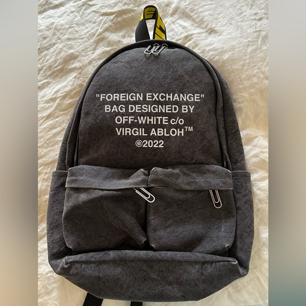 OFF-WHITE "FOREIGN EXCHANGE" BAG HARD CORE BACKPACK (NTW) slogan-print zip-up